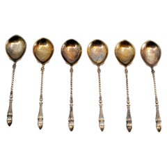Set of six silver-gilt teaspoons with twisted crowbar-shaped handles