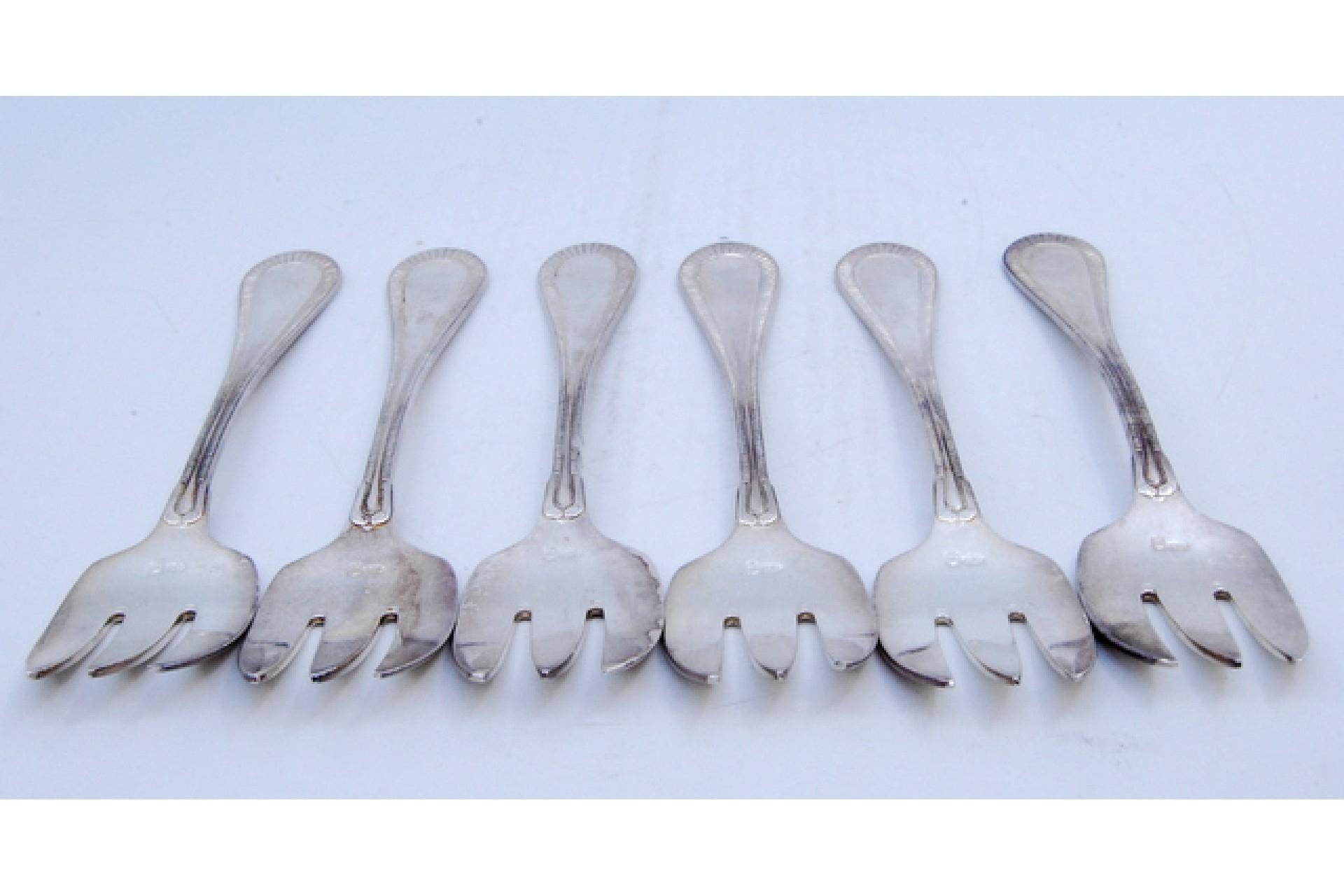 Description: Set of six silver oyster forks with grooves along the handles. Metal: Silver. Origin: Belgian. Brand: Brussels. Weight: 168.44 grams (Set of six forks). Dimensions: 13.5x2.8cm. Content: 835/1000. Assay Mark: Yes. Additional information: