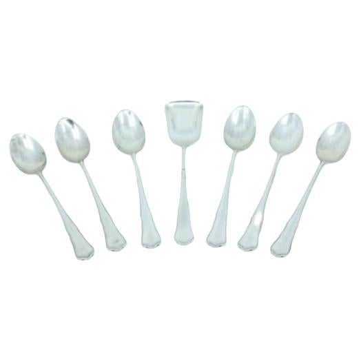 Set of six silver teaspoons and sugar scoops with trim around the handles