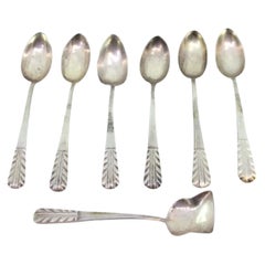 Set of six silver teaspoons and sugar shovel with herringbone reliefs