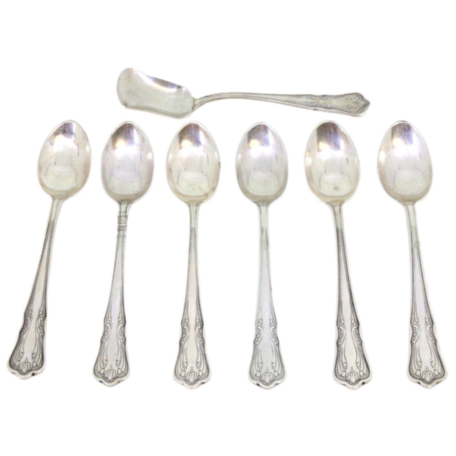 Set of six silver teaspoons
sugar scoop w/ engraving
trim on the handles