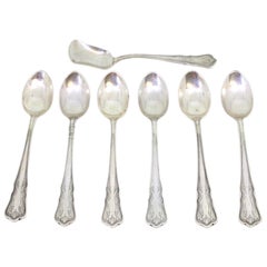 Set of six silver teaspoons
sugar scoop w/ engraving
trim on the handles