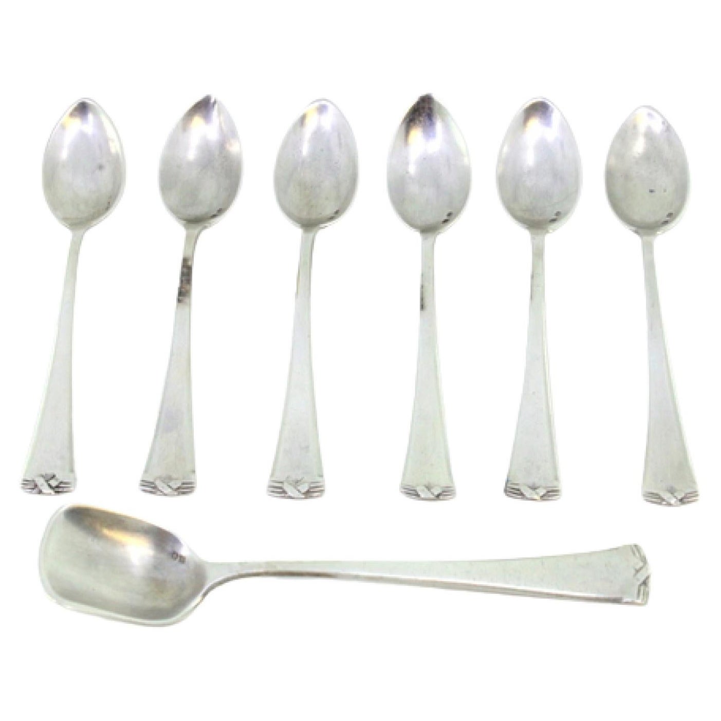 Set of six silver teaspoons
sugar scoops w/ reliefs on the ends of the handles