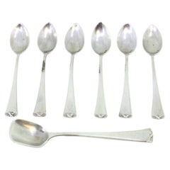 Set of six silver teaspoons 
sugar scoops w/ reliefs on the ends of the handles