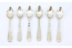 Set of six silver teaspoons with embossed handles in the style of reeds