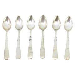 Set of six silver teaspoons with embossed handles in the style of reeds