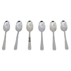 Set of six silver teaspoons with engraved handles