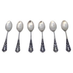 Set of six silver teaspoons with floral motifs on the handles