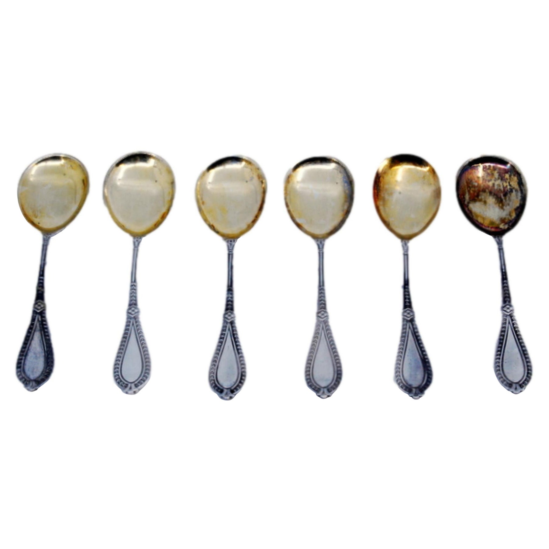 Set of six silver teaspoons with gold ladles and beaded handles