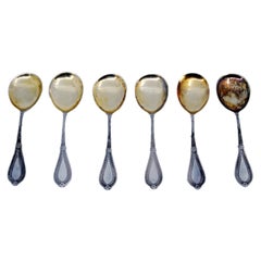 Set of six silver teaspoons with gold ladles and beaded handles