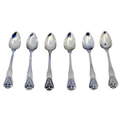 Set of six silver teaspoons with palms in relief on the handles