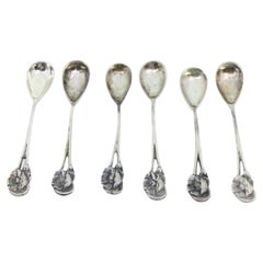 Set of six silver teaspoons with reliefs and flowers on the handles