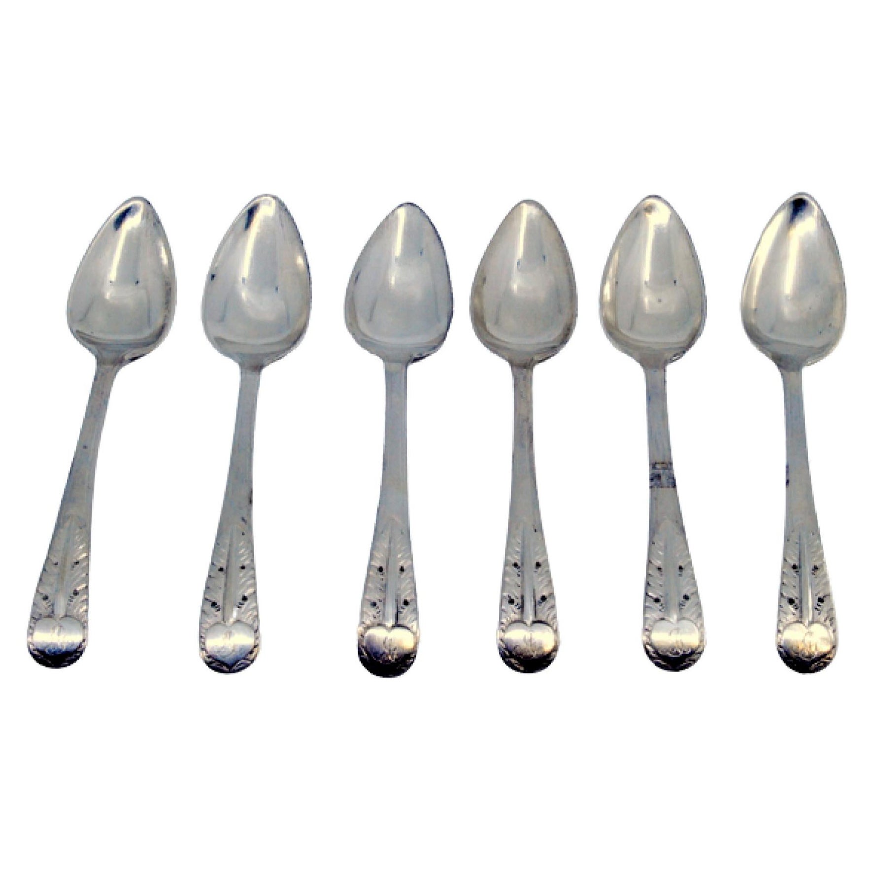 Set of six silver teaspoons with reliefs on the handles