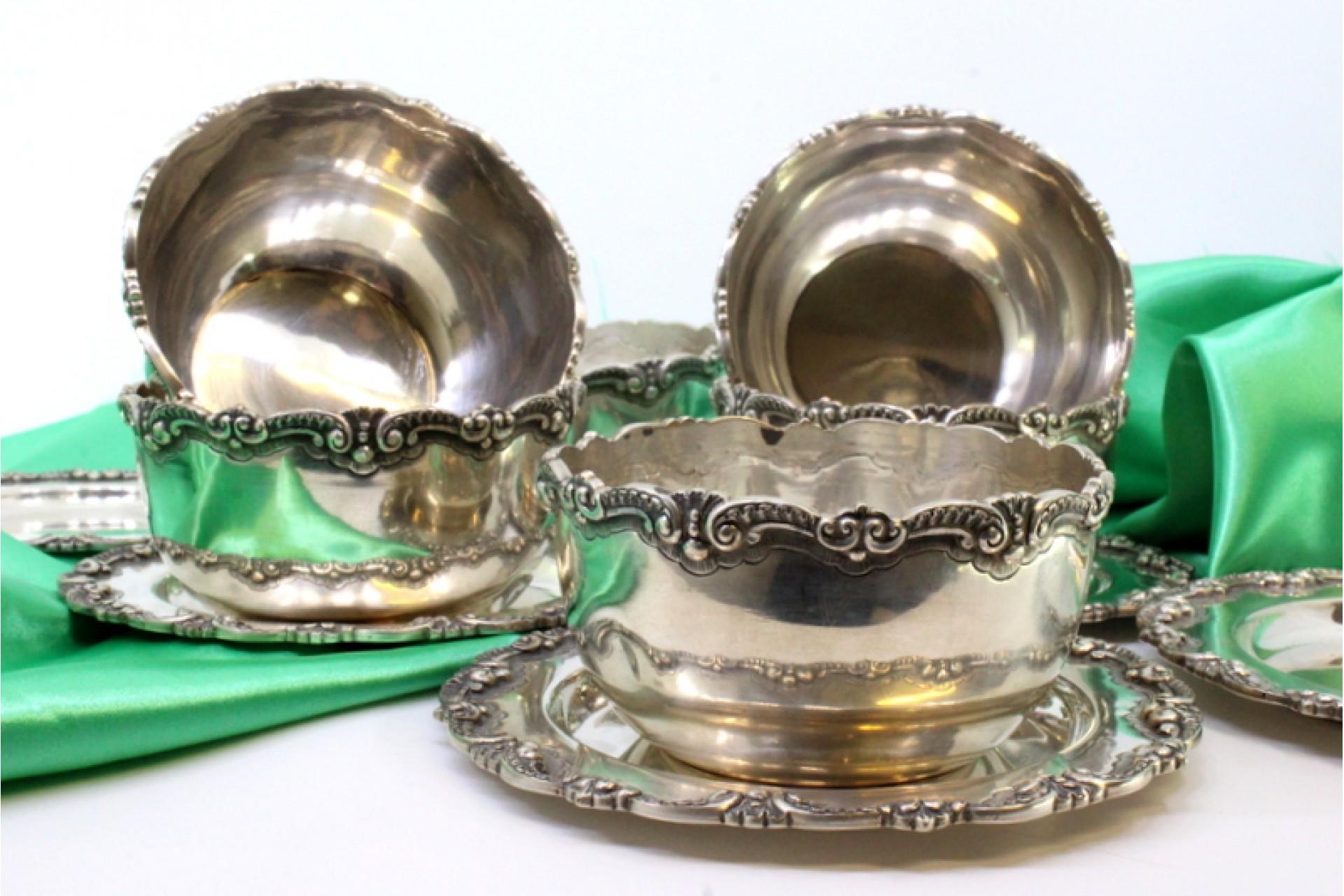 Description: Set of six silver washbasins and plates with raised edges. Metal: Silver. Origin: Portuguese. Mark: standing eagle. Weight: 1612.74 grams (Set of washbasins and plates). Dimensions: 29.2cmx23.7cm. Content: 833/1000. Assay Mark: Yes,