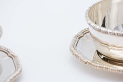 Set of six silver washbasins with beaded plates