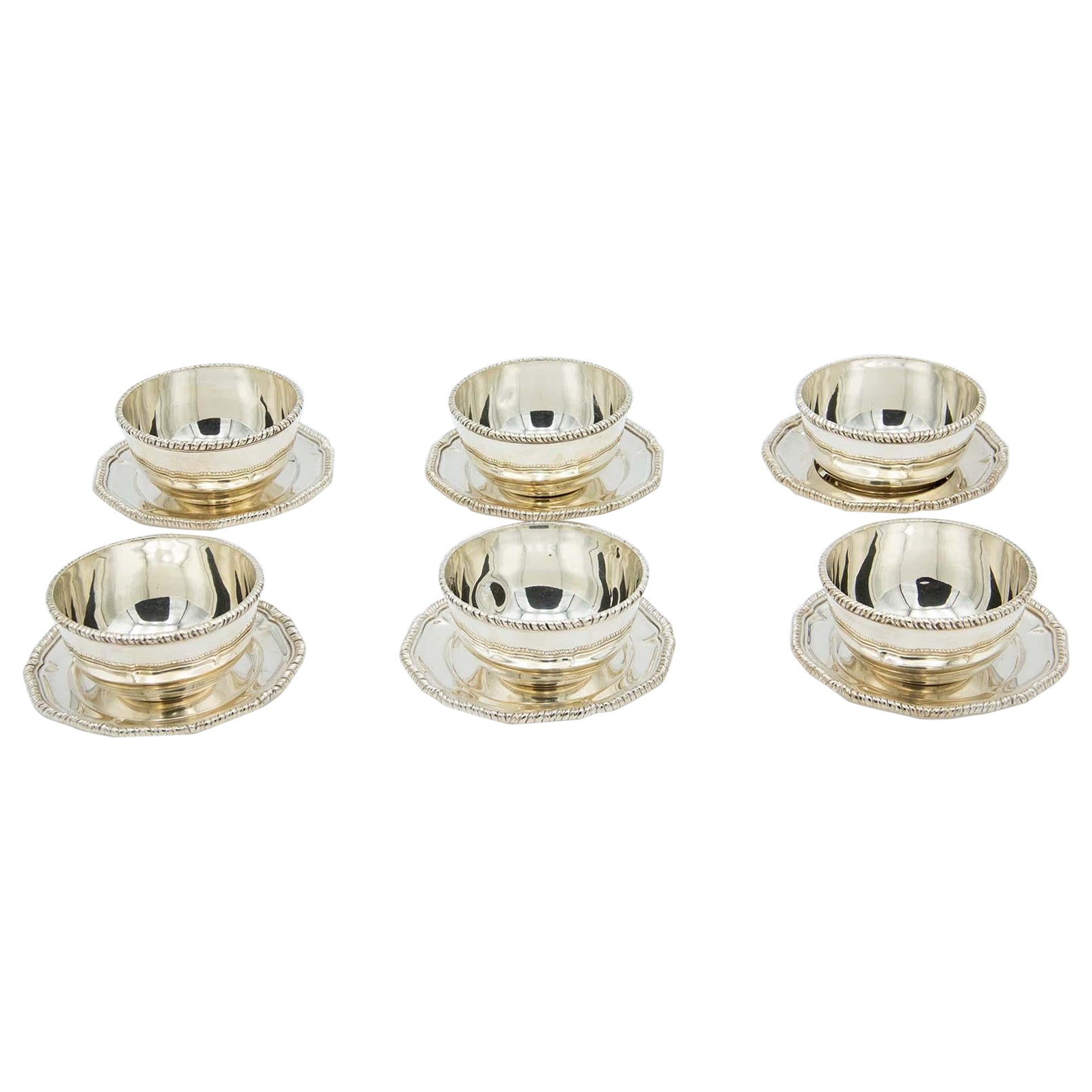 Set of six silver washbasins with beaded plates