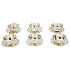 Set of six silver washbasins with beaded plates