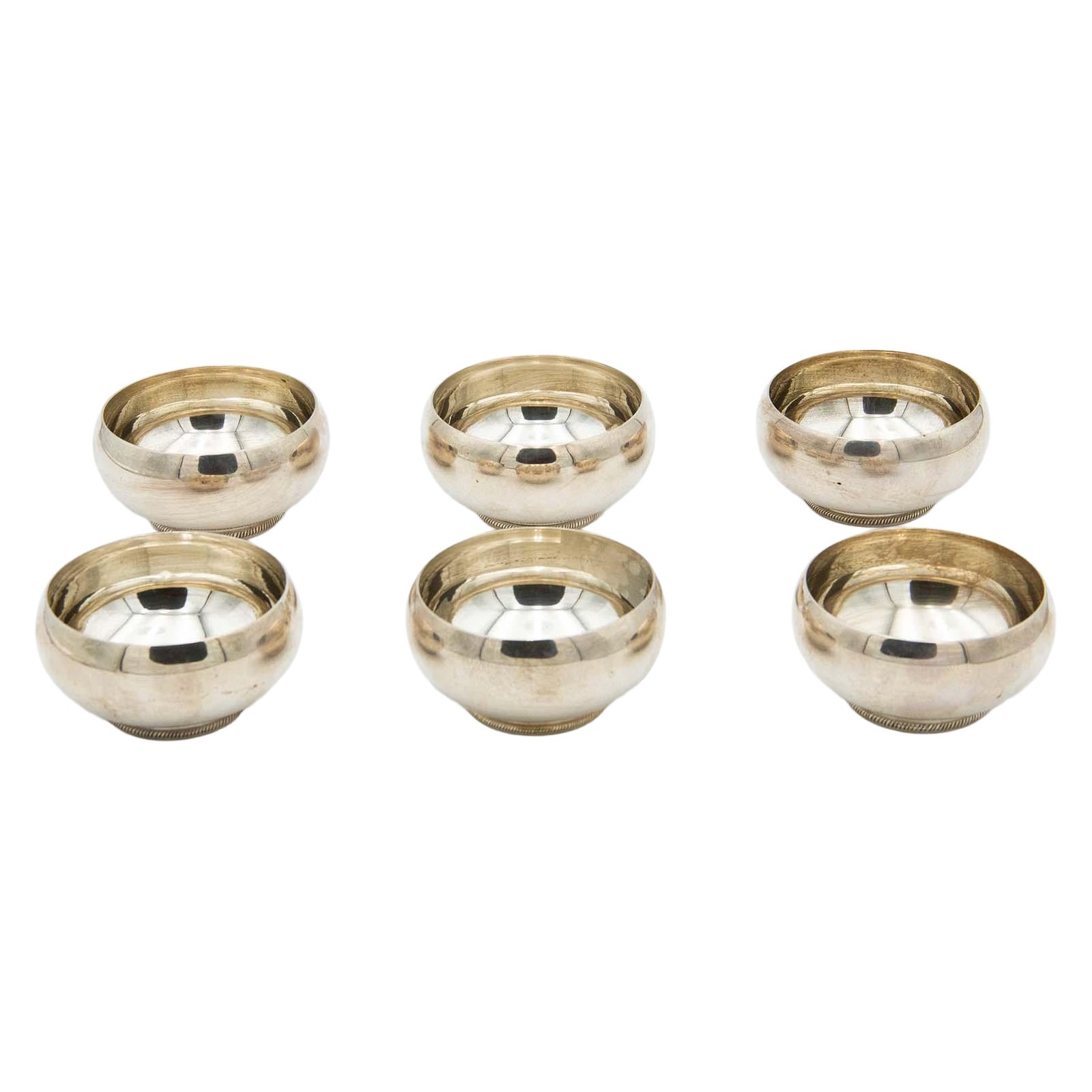 Set of six silver washbasins with beads