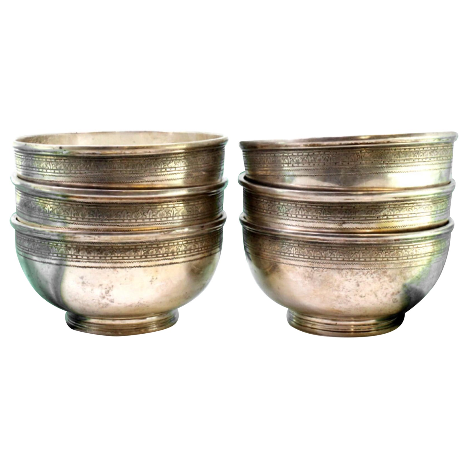 Set of six silver washbasins with engraved friezes on the surrounds