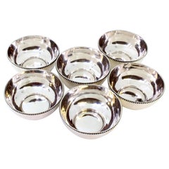 Set of six silver washbasins with pearly edges
