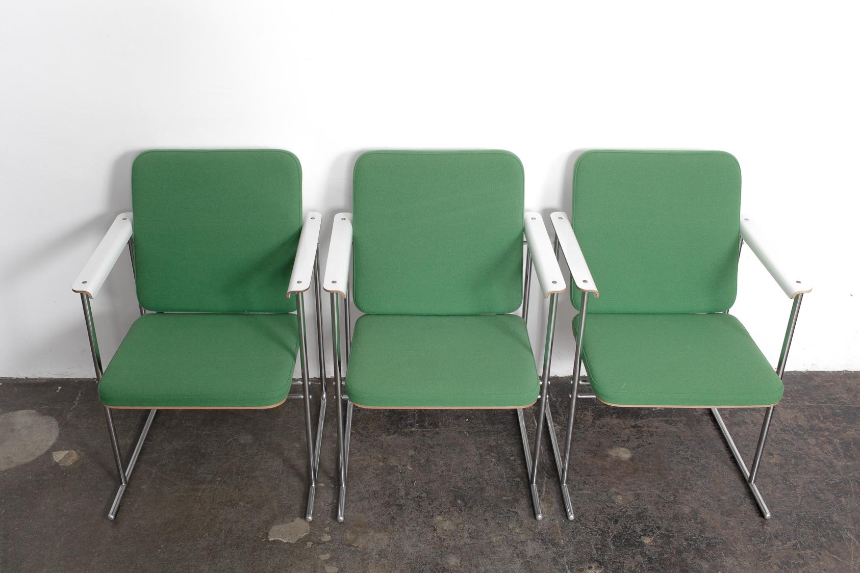Set off six 'Skaala' dining chairs designed by Yrjö Kukkapuro and produced by Avarte, Finland. White enameled birch laminate seat and back with original green woven fabric cushions and chrome-plated tubular steel frame with sleigh style legs. Marked