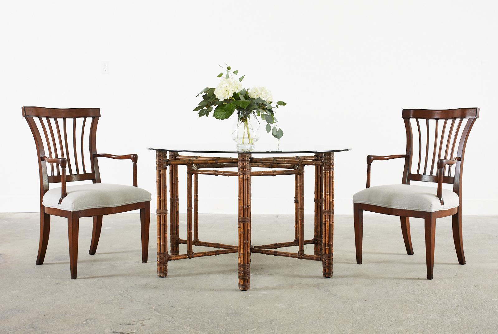 Bespoke set of six hardwood dining armchairs made by John Hall Designs Los Angeles, CA. The chairs feature a flared back with arched slats. The generous seat is bowed in front and has wide arms that gracefully curve back with a lovely profile. Newly