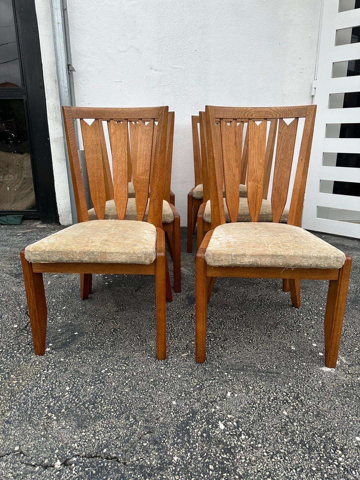 Vintage Oak dining chairs designed in 1965 by the world-famous French duo, Robert Guillerme and Jacques Chambron.  These dining chairs perfectly explain why, through proportions, unique concepts and the quality of woodworking at the highest level,
