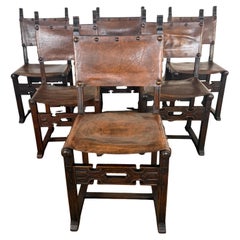 Set of Six Spanish Revival Leather and Carved Wood Armchairs