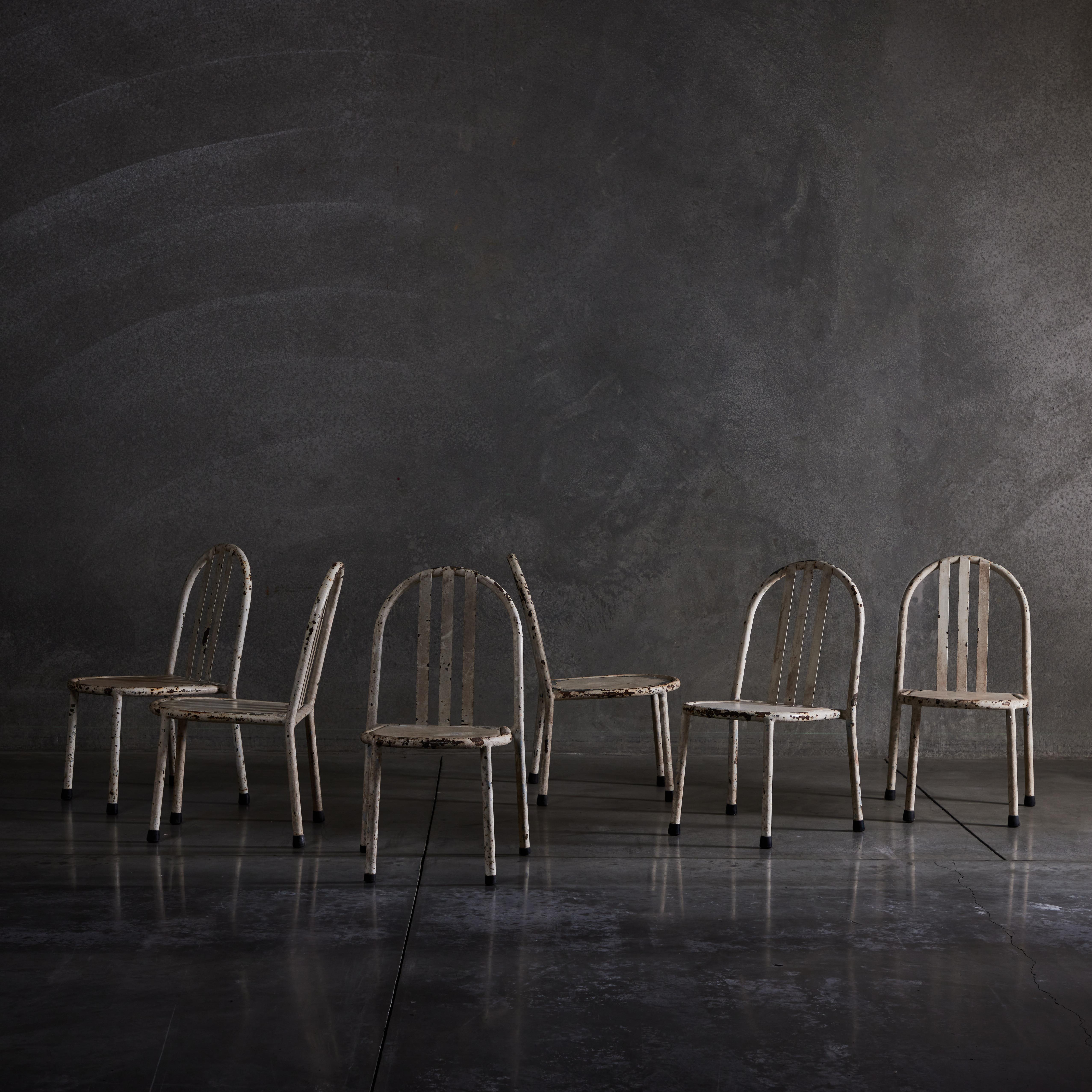 Rare ensemble de six chaises basses empilables de Robert Mallet-Stevens en état d'origine avec une forte patine de finition.

littérature : Robert Mallet-Stevens : l'Oeuvre Complète, Centre Pompidou, ppg. 62-63, 173 
