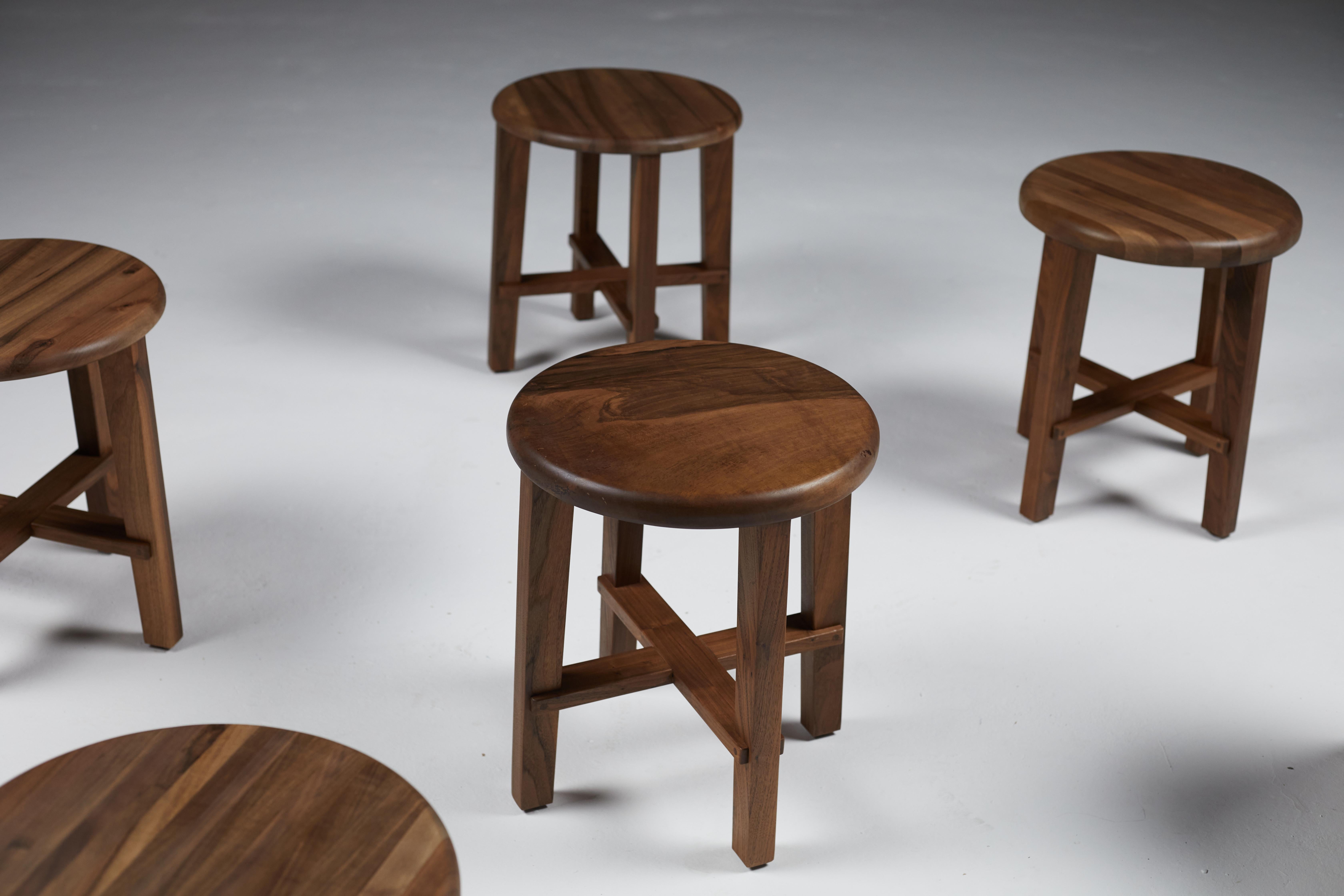 A set of six low stools, the stools can also be used as side tables.
The legs are made of American Black Walnut with the tops of European Walnut.
The finish is a Hard Wax Oil.
Each stool has the consecutive edition-making number 335, numbered 1 to 6