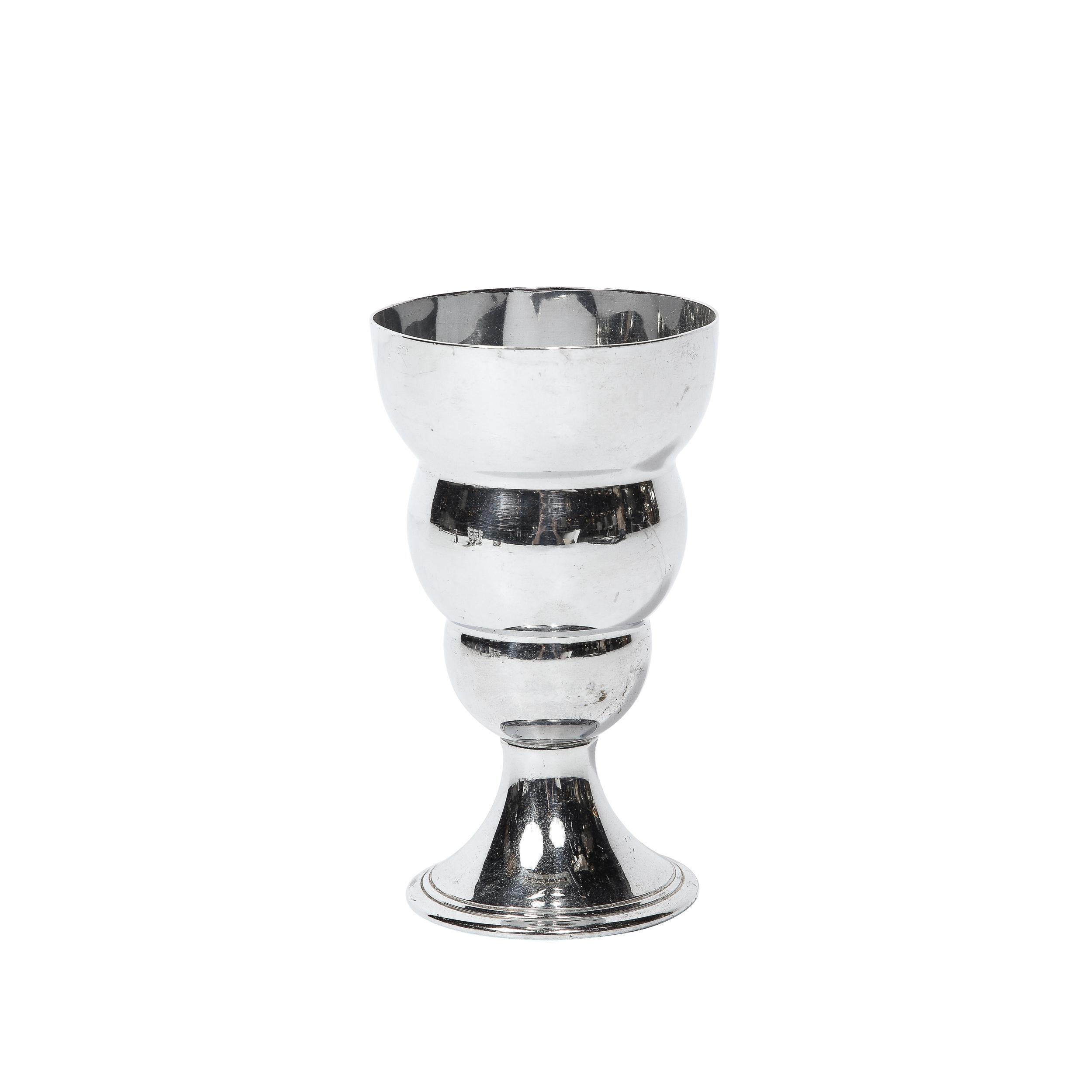 The Set of Six Art Deco Cocktail Glasses in Chrome American, Circa 1930 is a brilliant example of material and design of the era. It features a stacked spherical design rising from the base of the cups, rounded with a great feel in the hand,
