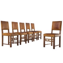 Set of Six Swedish Dining Chairs in Oak and Patinated Cognac Leather