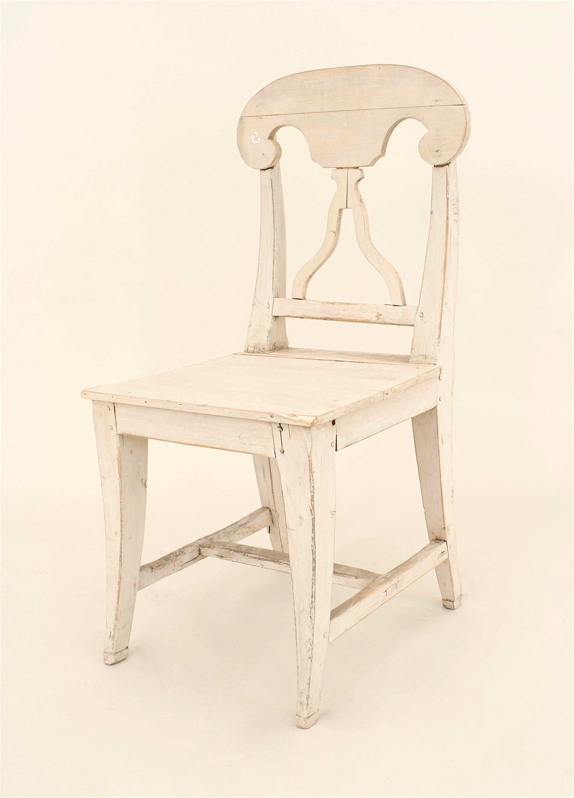 Set of 6 Swedish Gustavian mid century side chairs with an antique white painted finish and an open back design
