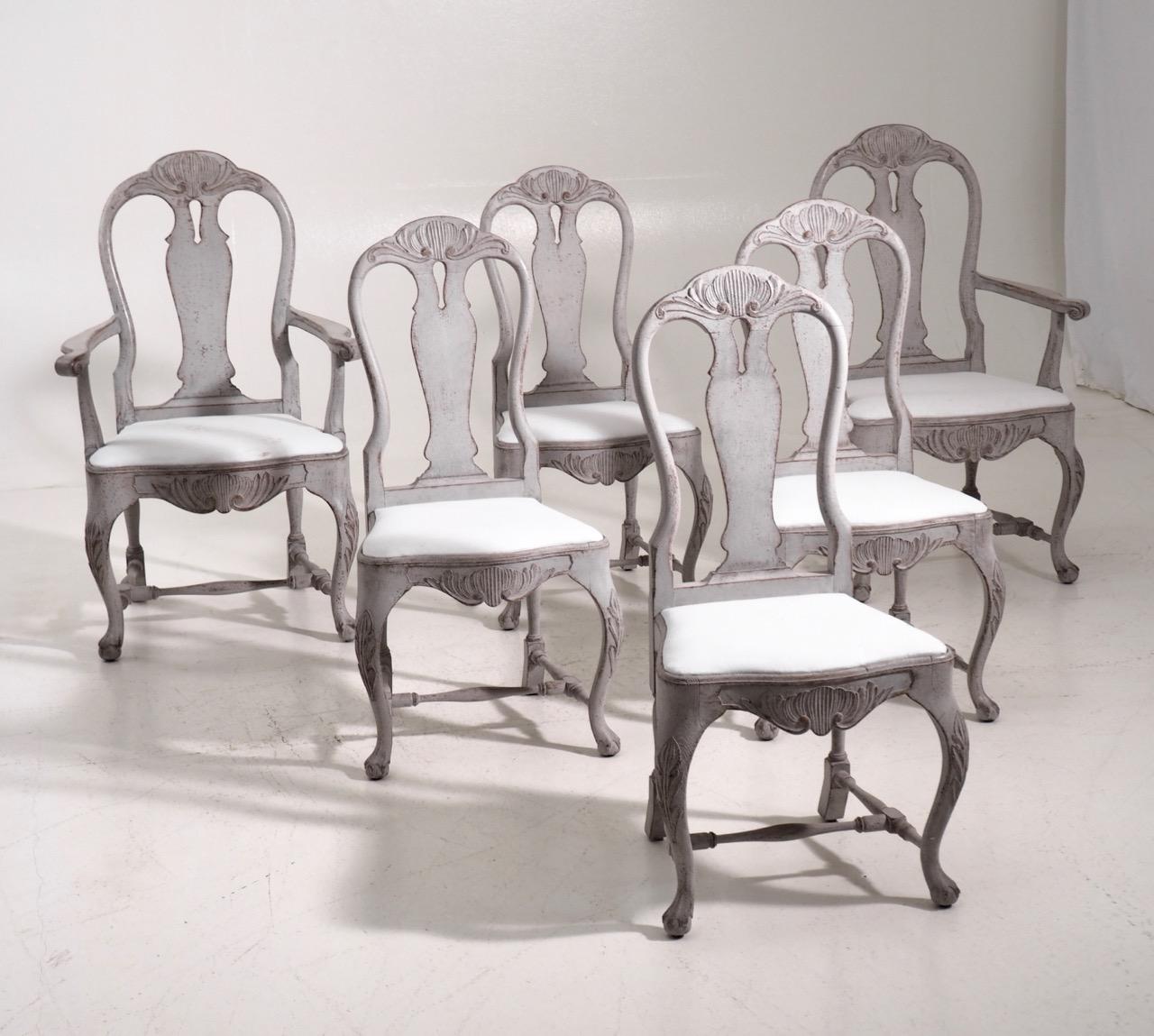 Fine set of six Swedish Rococo style chairs, including two armchairs, richly carved, circa 100 years old.

Measures: Armchairs:
H. 111 H-seat. 47 W. 70 D. 52 cm
H. 43.7 H-seat. 18.5 W. 27.5 D. 20.4 in
Chairs:
H. 105 H-seat. 46 W. 52 D. 43