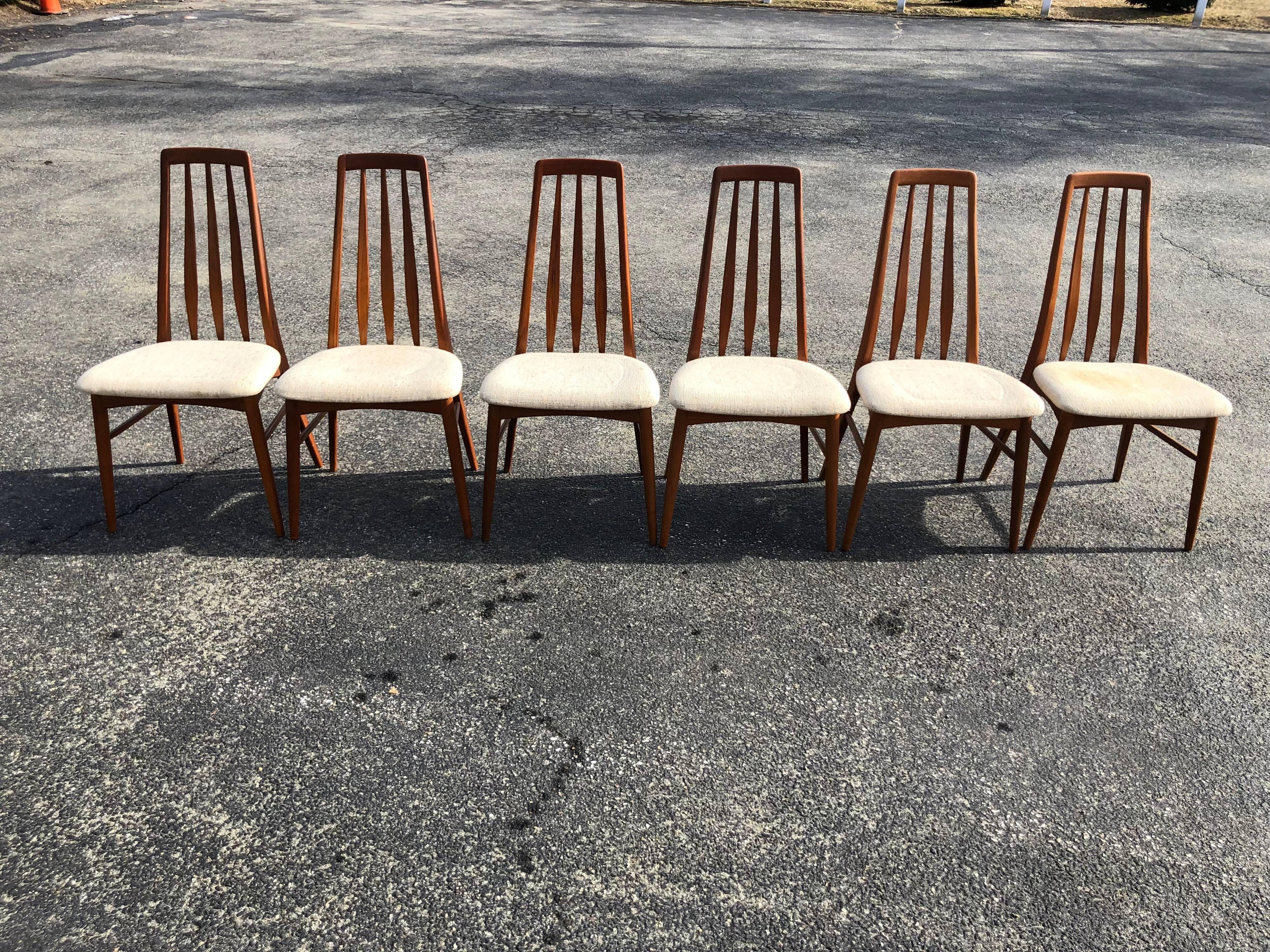 Set of six teak “Eva” chairs by Eva chair by Niels Koefoed for Hornslet Mobelfabrik in teak. In excellent condition except for discoloration on one chair seat, see photos. Original upholstery. Dimensions are 38 in h x 19 in w x 18 in D. Seat height