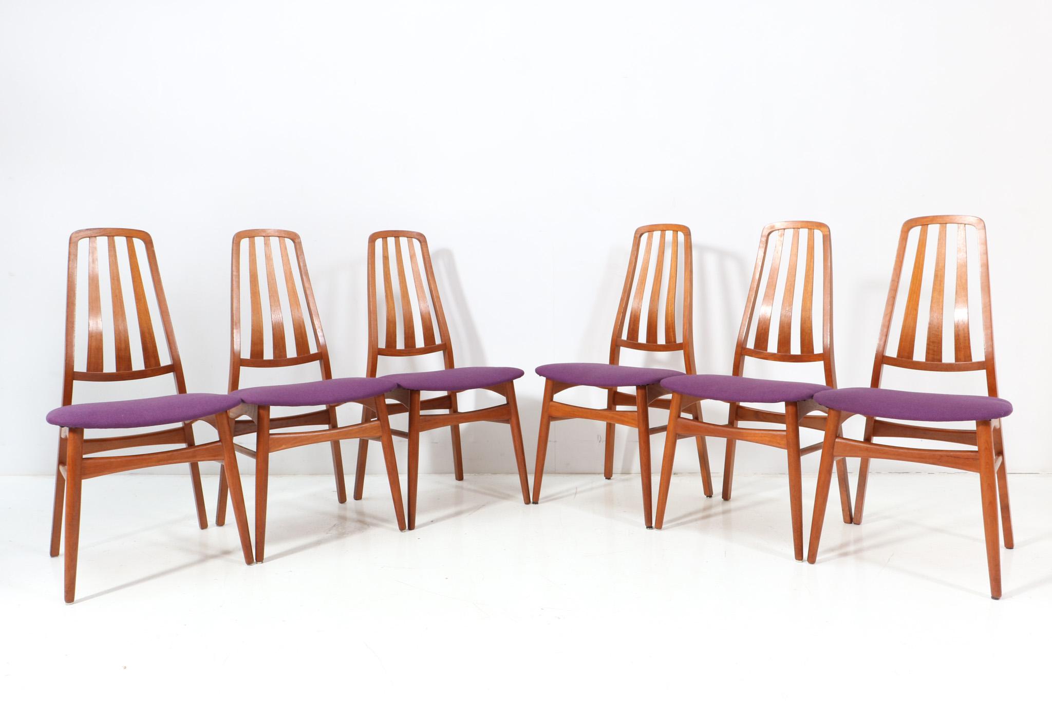 Stunning set of six Mid-Century Modern dining room chairs.
Marked with original label IMHA.
Striking Danish design from the 1960s.
Solid teak high back frames.
Seats are re-upholstered with purple fabric.
This wonderful set of six Mid-Century Modern