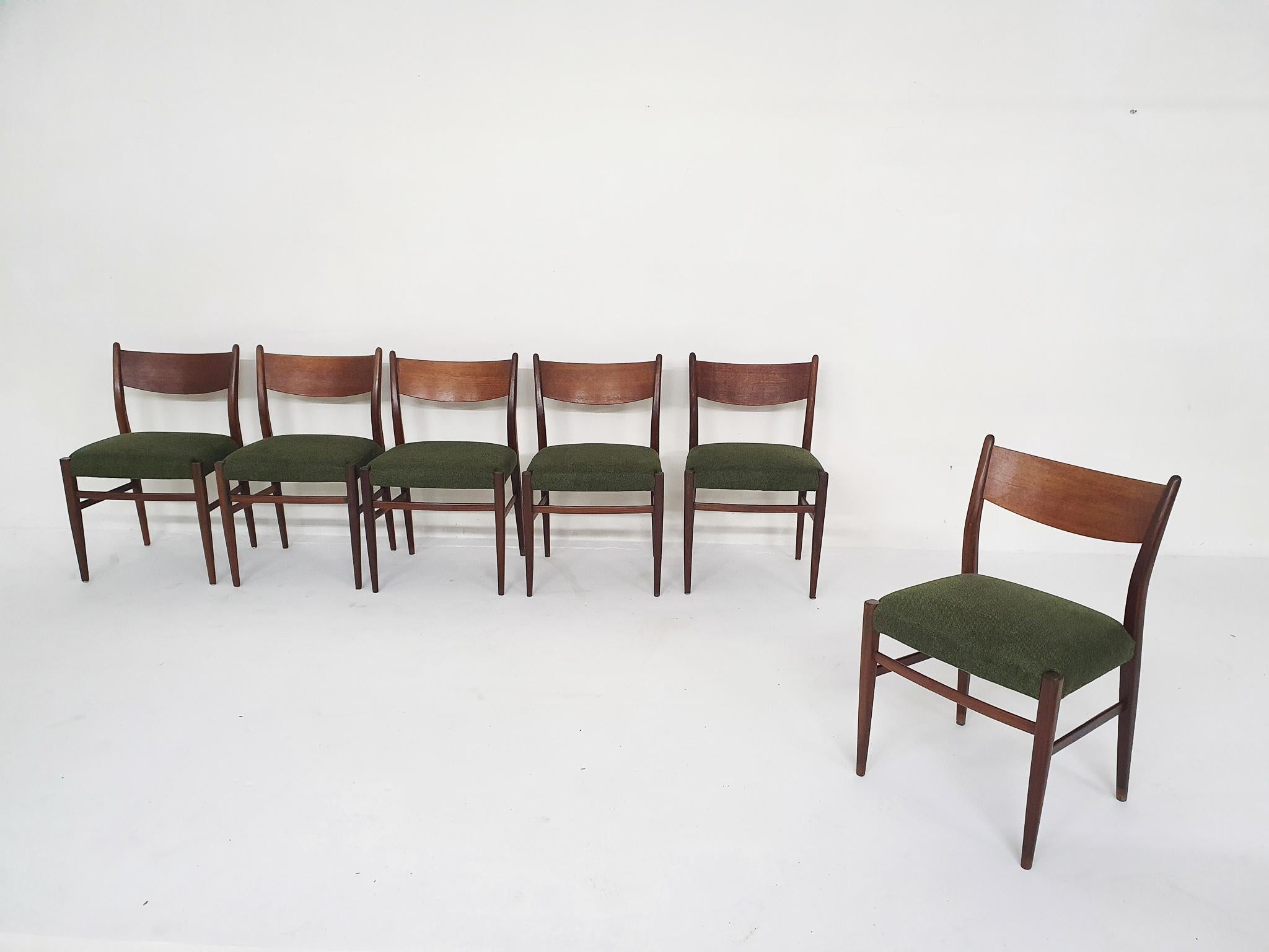 Teak dining chairs with new forrest green upholstery.
