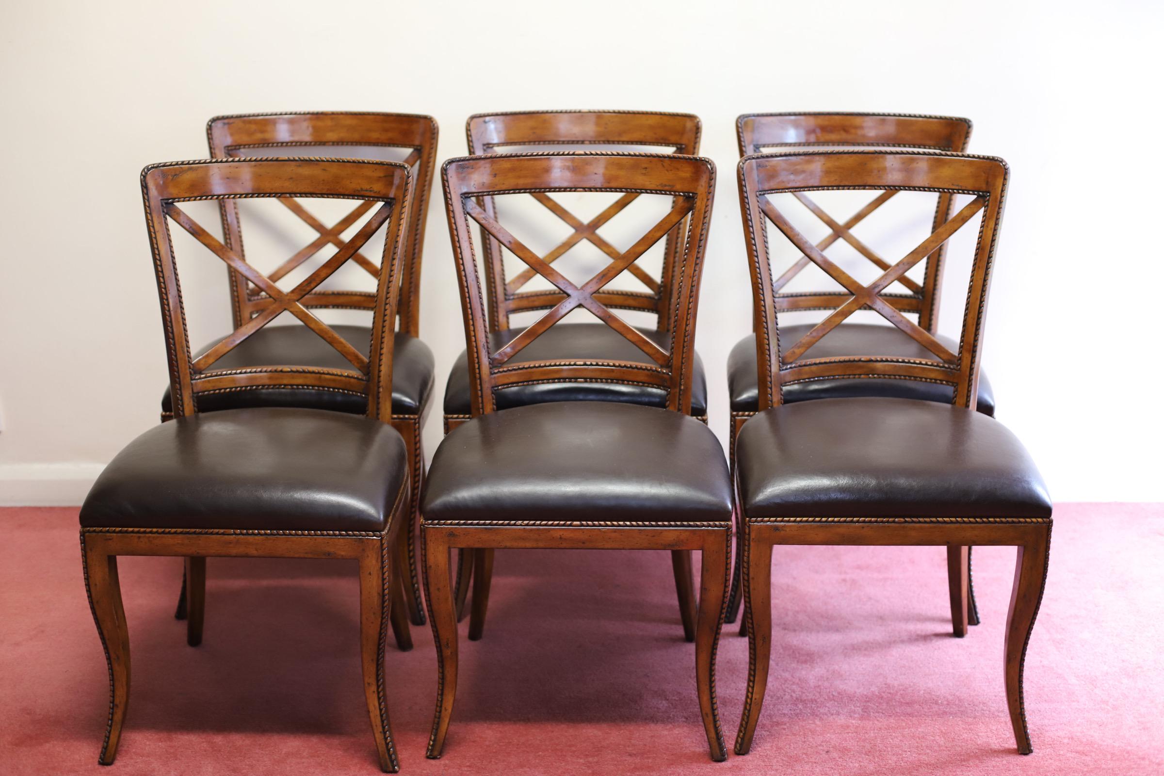 We are delight to ofer for sell this beautiful set of Six “Theodore Alexander” leather dining chairs , timber is some kind of flamed mahogany, it has a glorious patina throughout and they are in very good condition .
Don't hesitate to contact me if