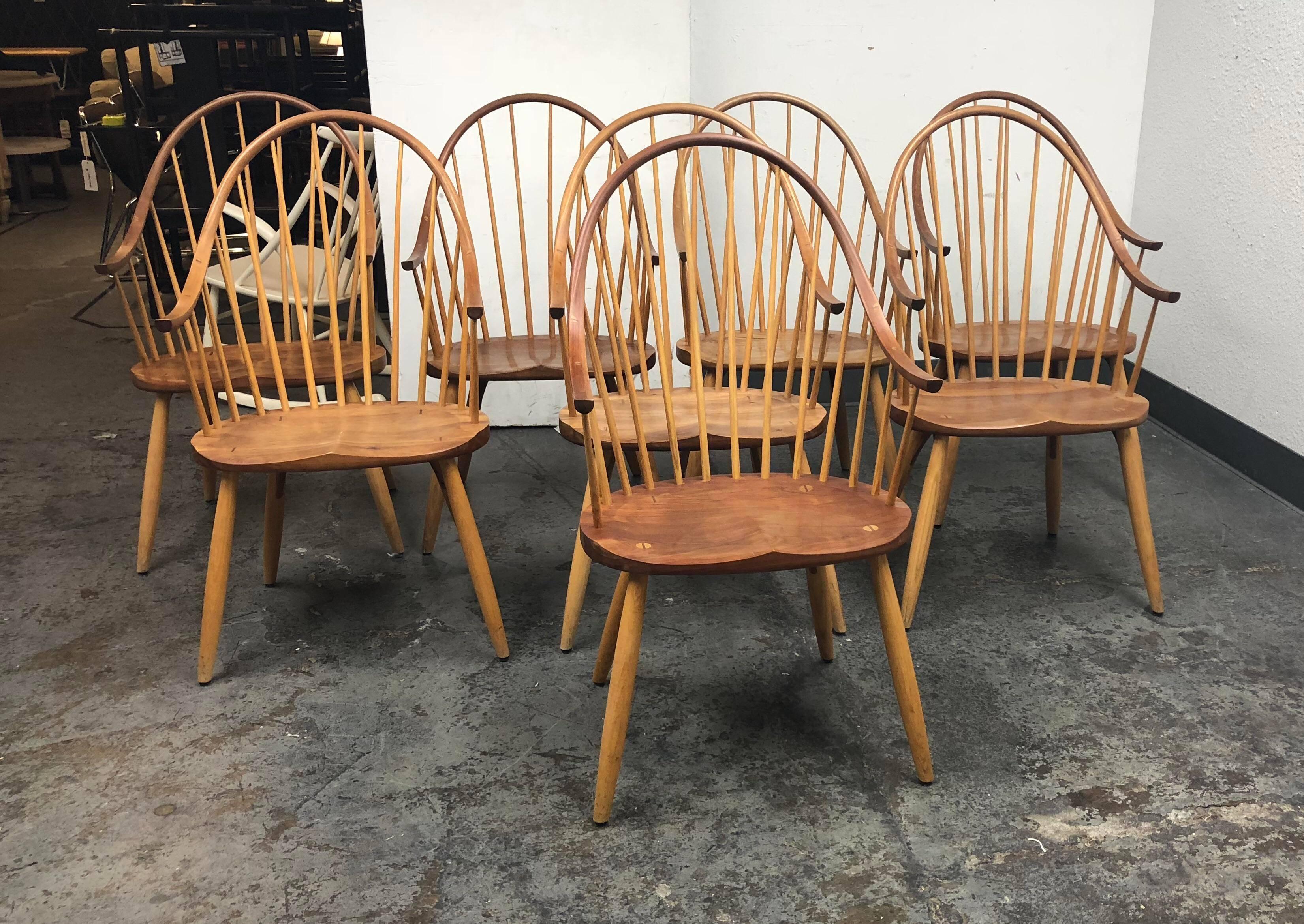 A set of eight dining chairs. The chairs were all made by hand in the Thomas Moser wood shop in Maine. The chairs were obviously inspired by the Classic windsor chairs. The are impeccably made with the standard of quality we have come to expect from