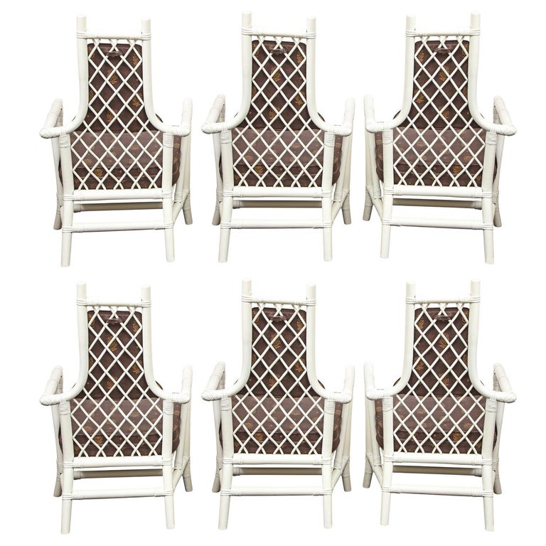 Set of 6 dining chairs in white lacquered bamboo with intricate woven criss cross backs and upholstered seats and backs by  Henry Olko for Willow & Reed, American 1950's. Henry Olko owned Willow & Reed and hired Tommi Parzinger to design for him. 