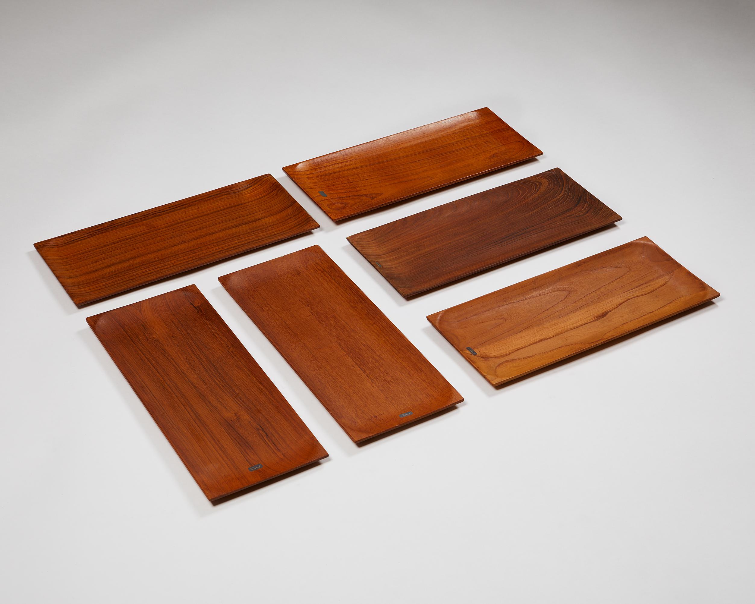 Set of six trays designed by Johnny Mattson,
Sweden. 1950s.
Solid teak.

Stamped.

Measures: H: 1.8 cm / 3/4