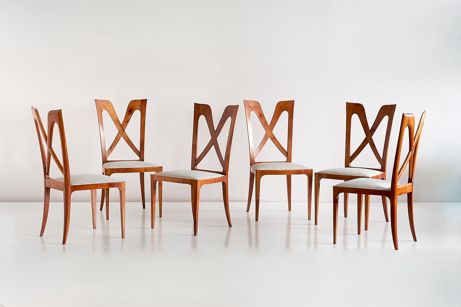 This exceptional set of dining chairs was designed by Don Ulderico Carlo Alberto Forni for a private residence in Milan. The design was produced by hand by a master carpenter in the Como area in the late 1940s. 
The frame of the chair is in solid