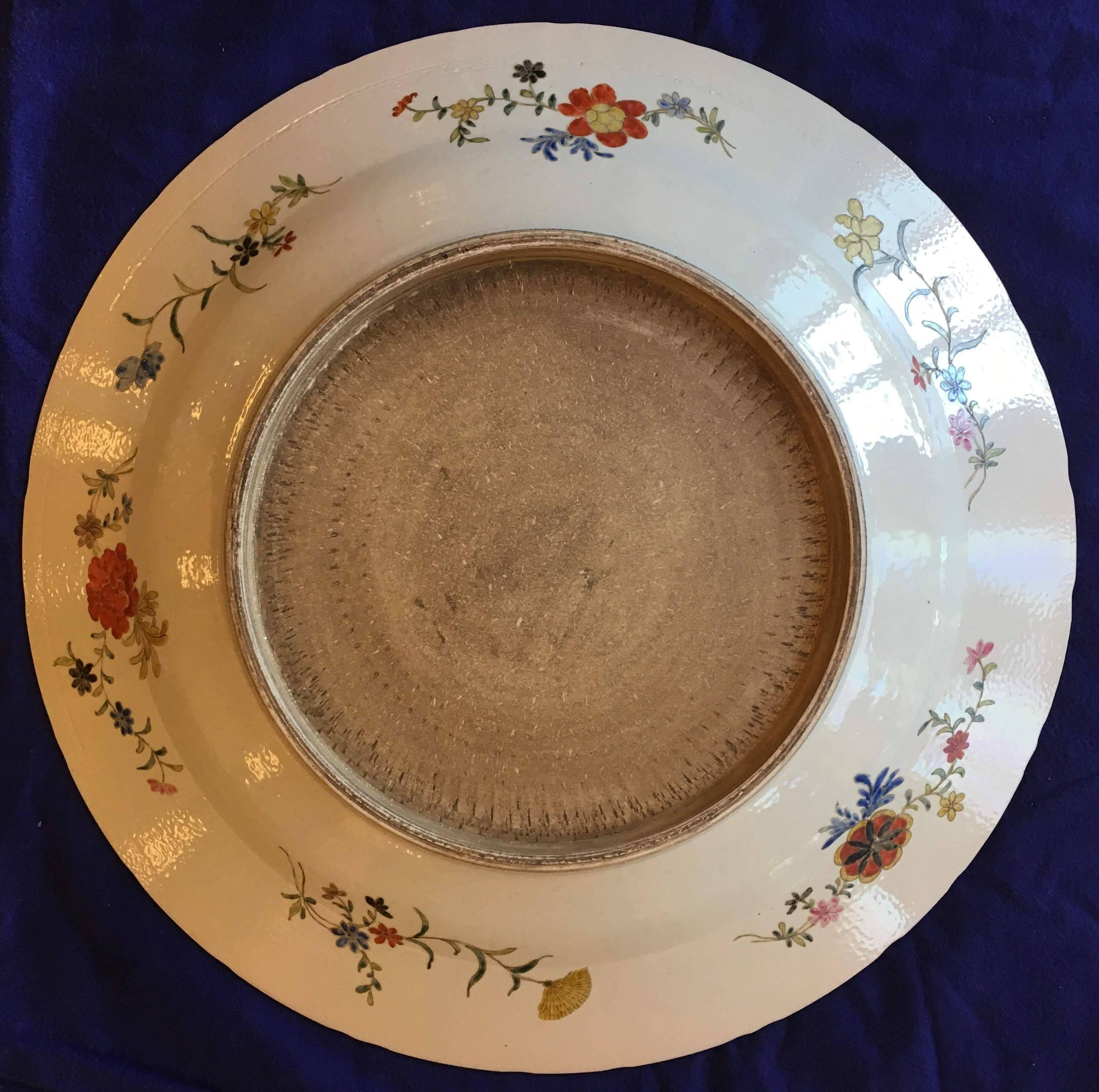 This extremely hard to find collection of six oversized hand-painted porcelain Chinese decorative platters from the Kangxi period (1662-1722) of the Qing Dynasty in the Kangxi wucai or famille verte style. Each platter is distinct from each other,