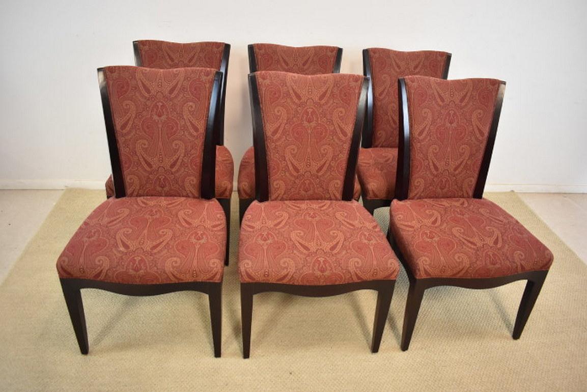 A beautiful set of six dining room chairs by Barbara Barry for Baker Furniture. They feature an espresso finish with a burgundy paisley fabric. The dining room table pictured is available under a separate listing. The dimensions are 22.5