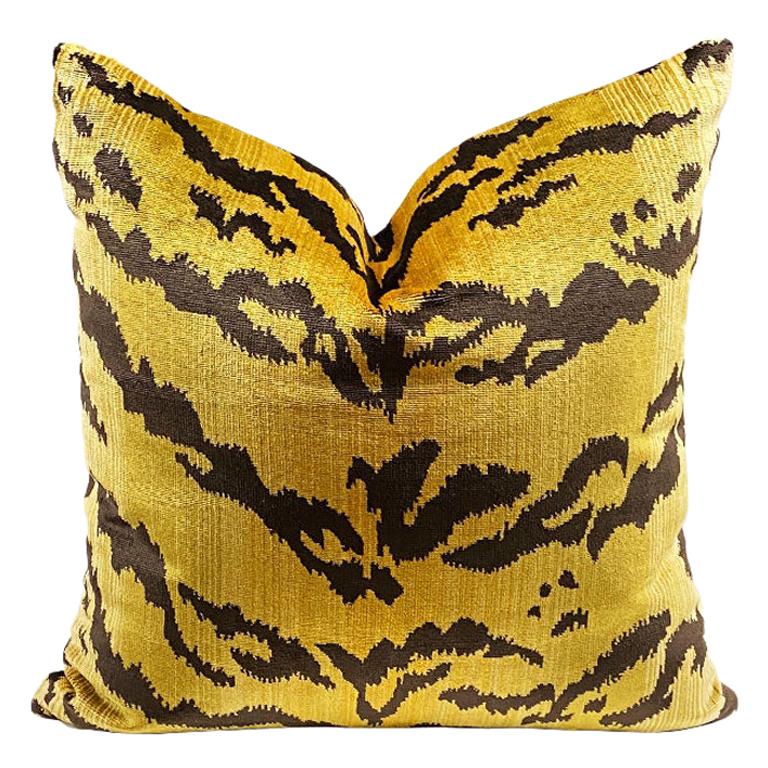 Square shape animal motif tiger print pillow. The front features a gorgeous thick velvet animal print. The back features a crisp cream. Down-filled. Knife edge with zipper. Fabric is a designer fabric and originates in Belgium.

Dimensions