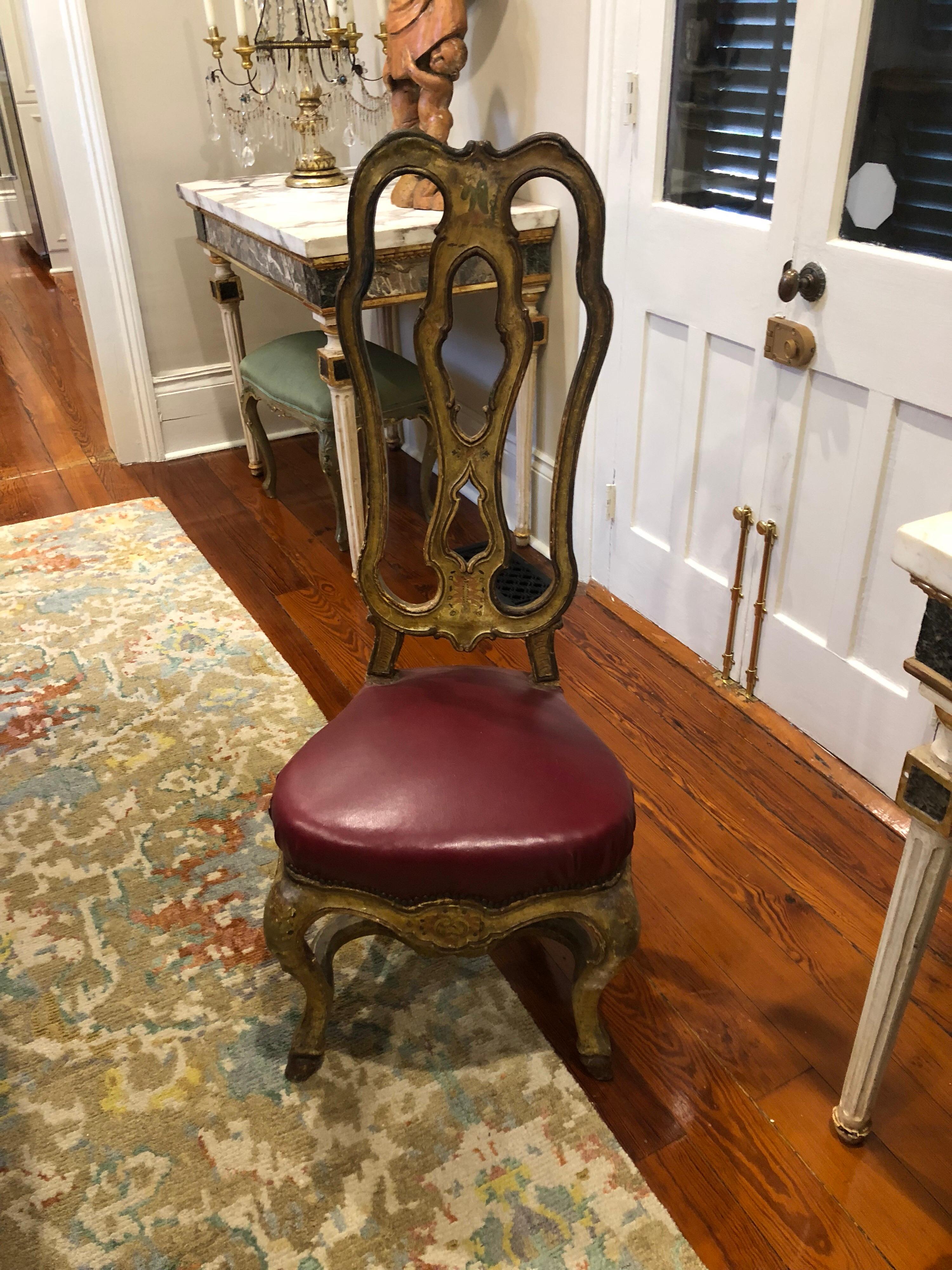 Set of six unusual and tall Venetian dining chairs with red leather seats. These chairs each have a man playing a musical instrument painted on the back splat. Each one is different. They have unusually high backs which makes them very visible above