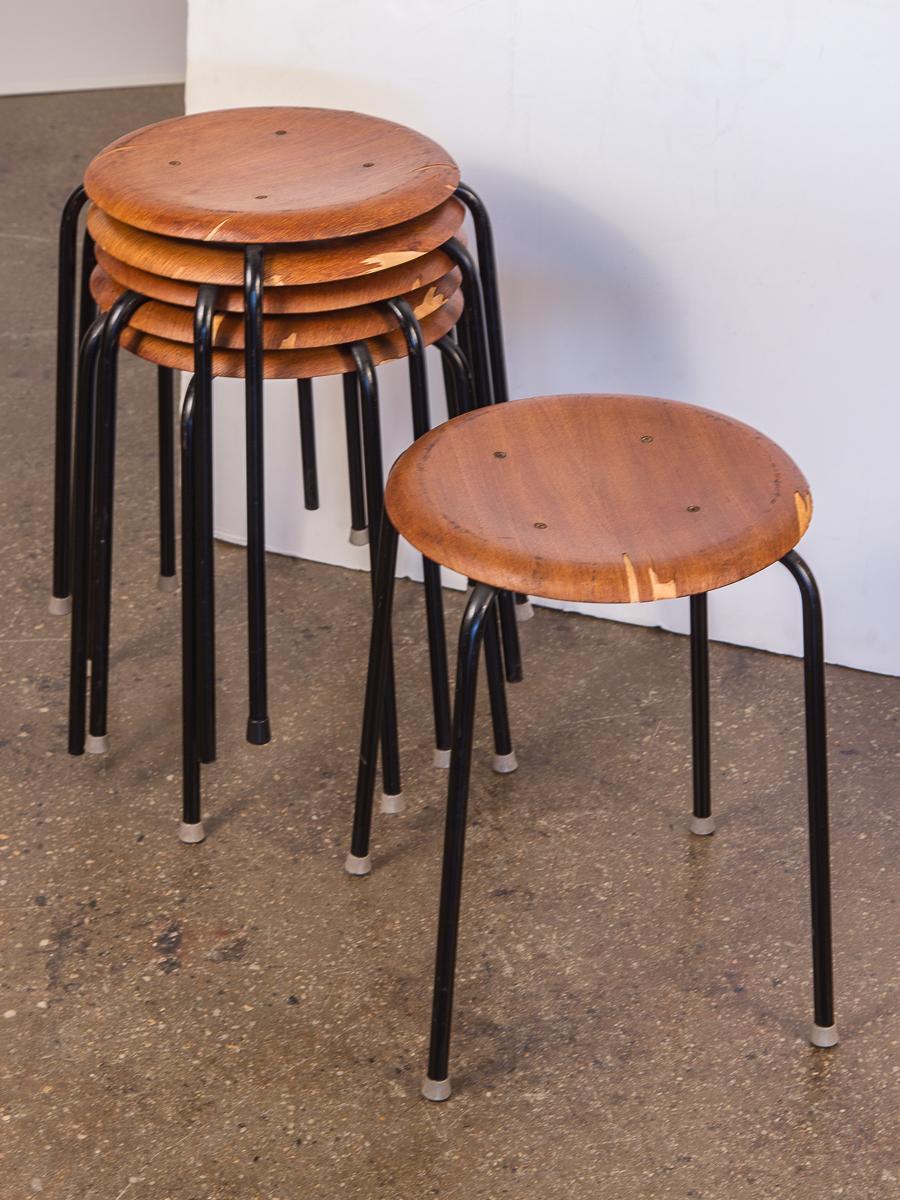 Set of six vintage Arne Jacobsen dot stools. Price is for the set. These pretty circular wooden tools have been lovingly owned, with a fair amount of age-appropriate wear. Some stools have chipping or discoloration to the surfaces as images show.