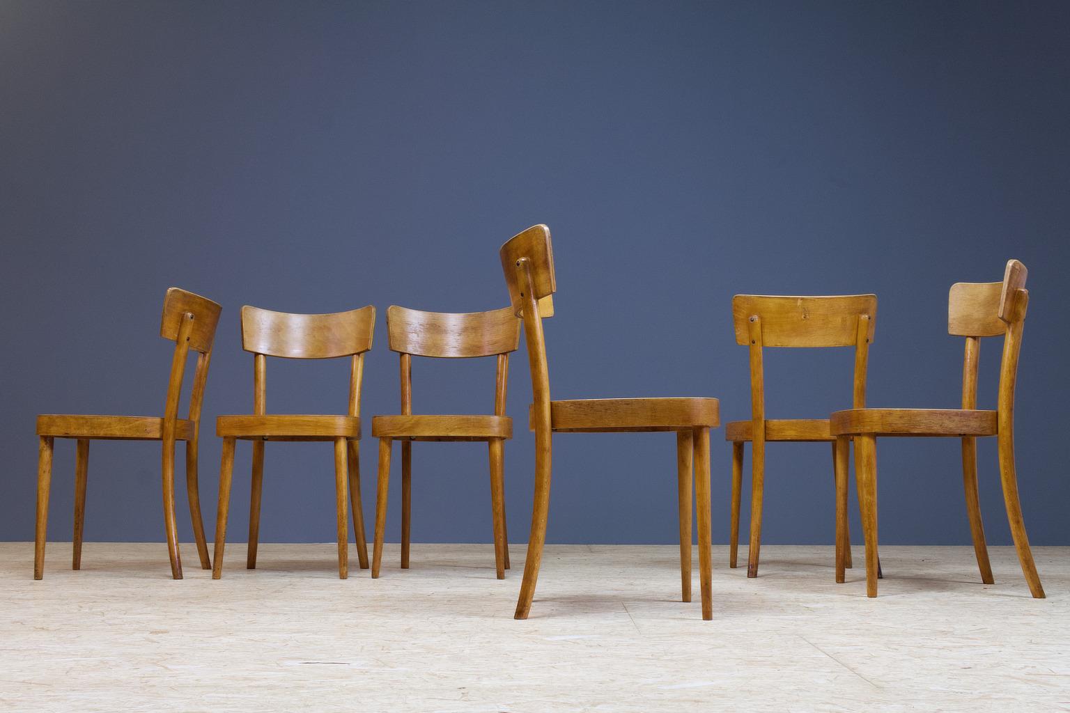 Set of six very charming birch plywood dining chairs, 1950s. A midcentury boutique or bistro set which holds clear features of the Thonet family, such as the bent back legs, the construction and the shape of the seating. The use of materials and