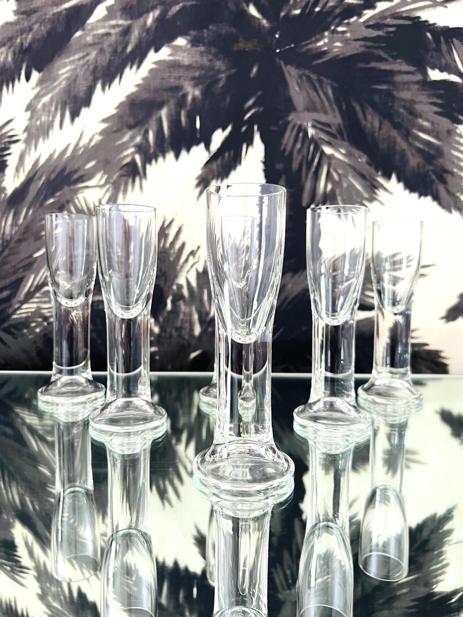 Set of 1980's crystal liqueur glasses from Czech Republic. The set includes six handblown tulip glasses with thick rounded and polished glass edges. Perfect as shot glasses or as cordials. Makes a chic addition to any barware or tableware setting.
