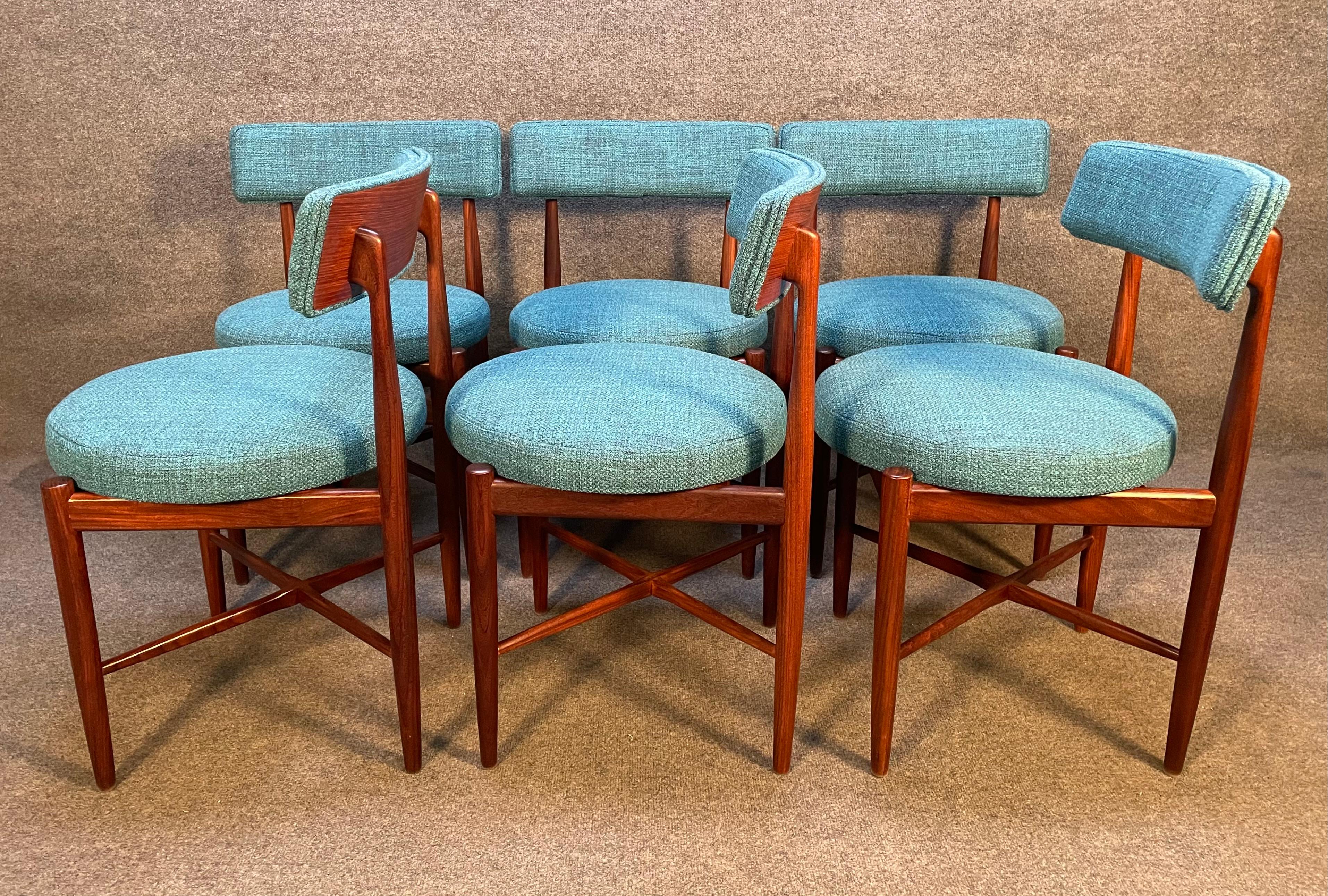 Here is an exquisite set of six vintage dining chairs in teak wood designed by Victor Wilkins and manufactured in England in the 1960s. These lovely and comfortable chairs set, recently imported form the UK to California before their restoration,